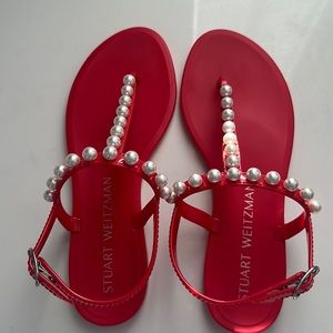 Stuart Weitzman red jelly sandals with pearl detail